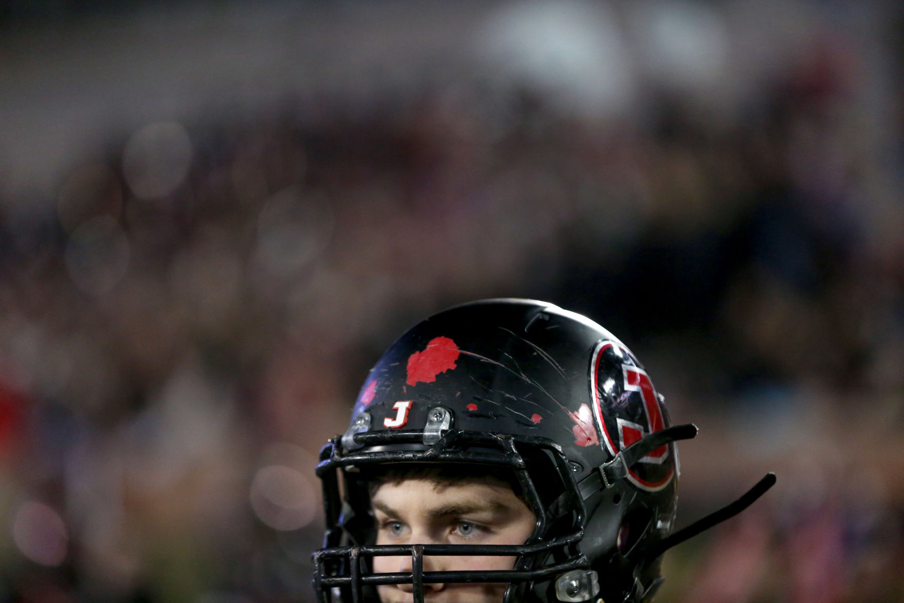 A Jackson High School' player watches the game